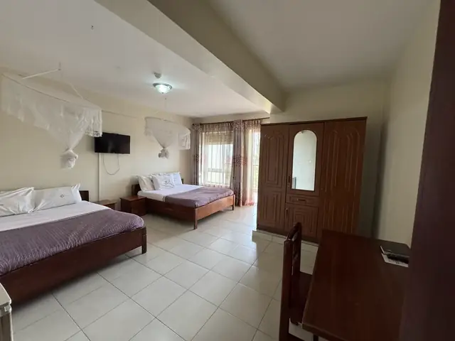 Executive Twin Room: twin beds, wooden wardrobe and desk